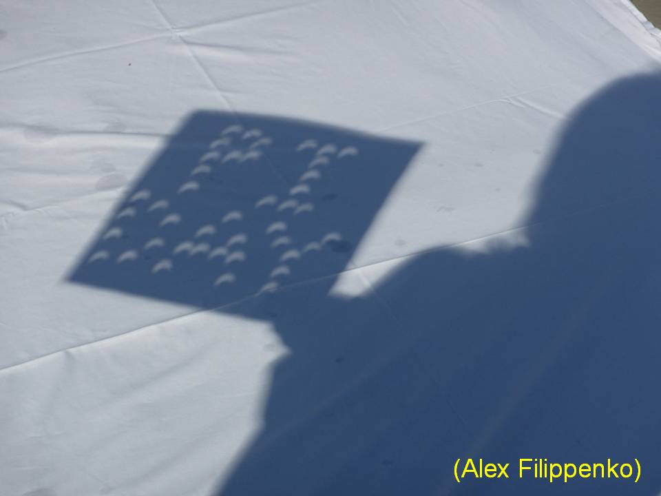 close-up of pi day crescents projected through the cardboard sign